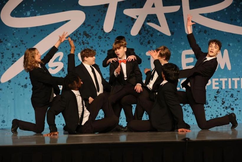 A musical theater class performing in costume